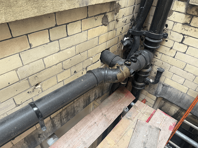 Ageing legacy pipework typical in older school buildings
