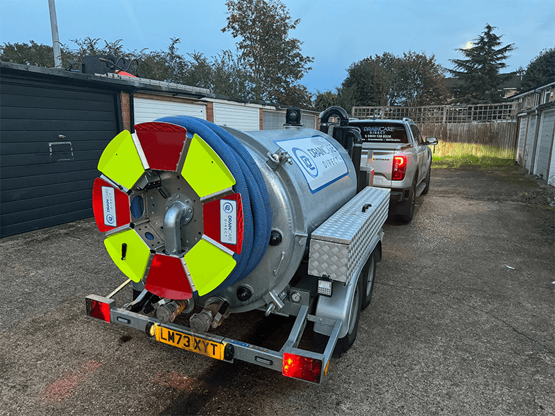 DrainCare Direct pump truck at a residential property